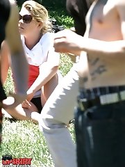 12 pictures - Public upskirt, of blondie in pink. She flashed her panties