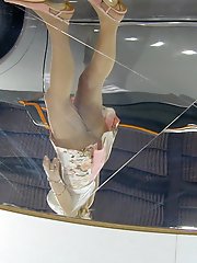 23 pictures - Reflection of upskirt of cute promogirl. Hot upskirt