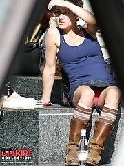 12 pictures - Female upskirt oops. Pink panties up her mini skirt